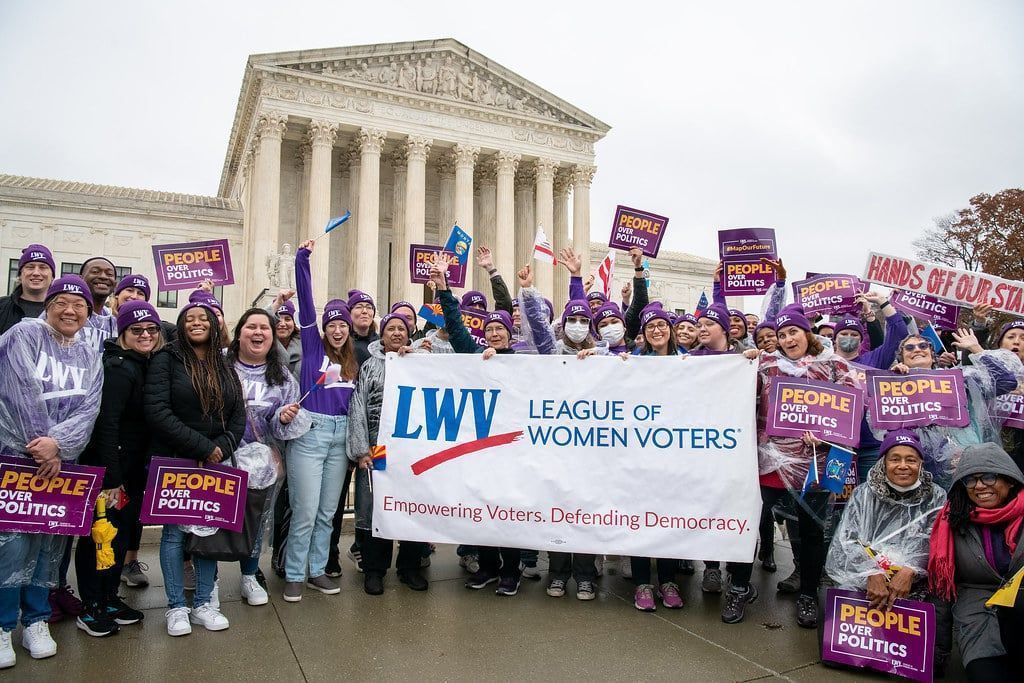 a group of LWV members in front of a government building in Washington DC