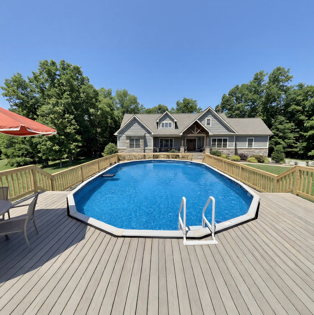 Above ground pool surrounded by a full wooden deck with ladder entry, set in a spacious backyard with a house and clear blue sky